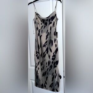 Express spaghetti strap mid length dress.  Satin feel, but 100% polyester. XS